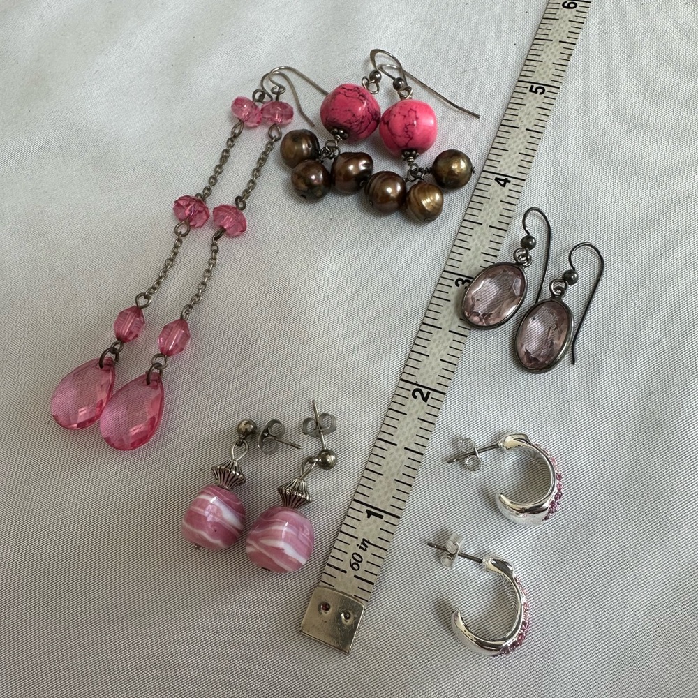 Five pair of pink vibe earrings